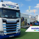 Lorry on grass in front of trailer