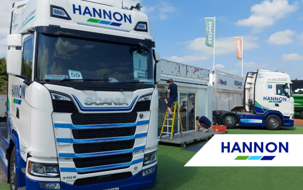 Lorry on grass in front of trailer