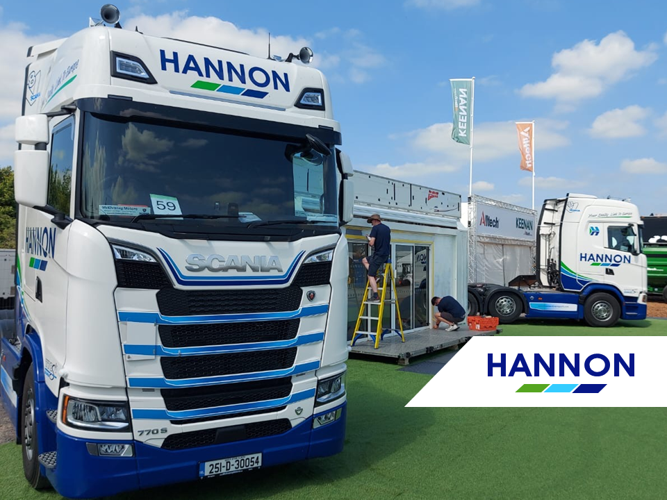 Lorry on grass in front of trailer