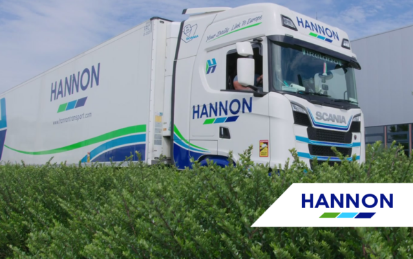 Truck positioned behind hedge