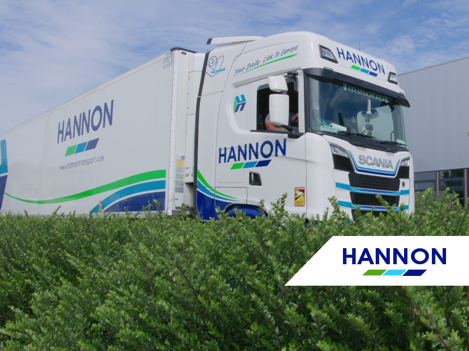 Truck positioned behind hedge