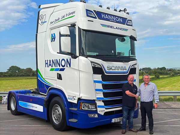 Week 20 - Bonus Blog - Longest-Serving Driver Gets First of 220 New Additions to HANNON Fleet People standing in-front of a truck