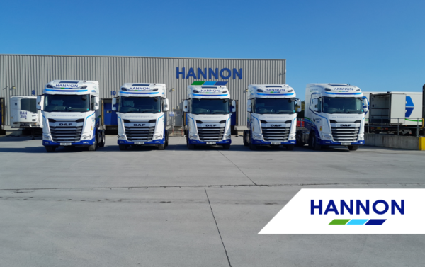 Fleet of Trucks in front of warehouse