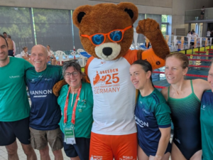 Group of people celebrating with mascot